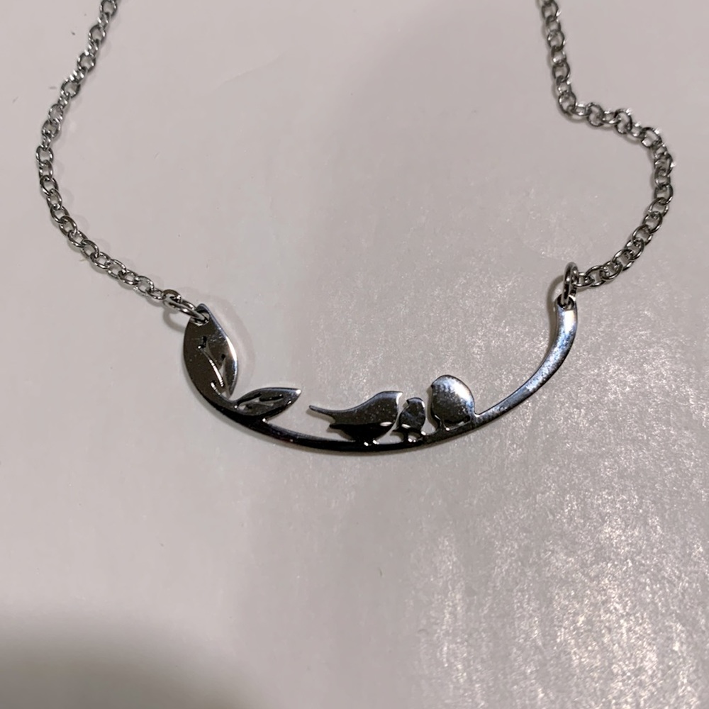NWOT Silver necklace with bird family on branch, never worn